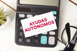 Financial aid text written on notepad with glasses