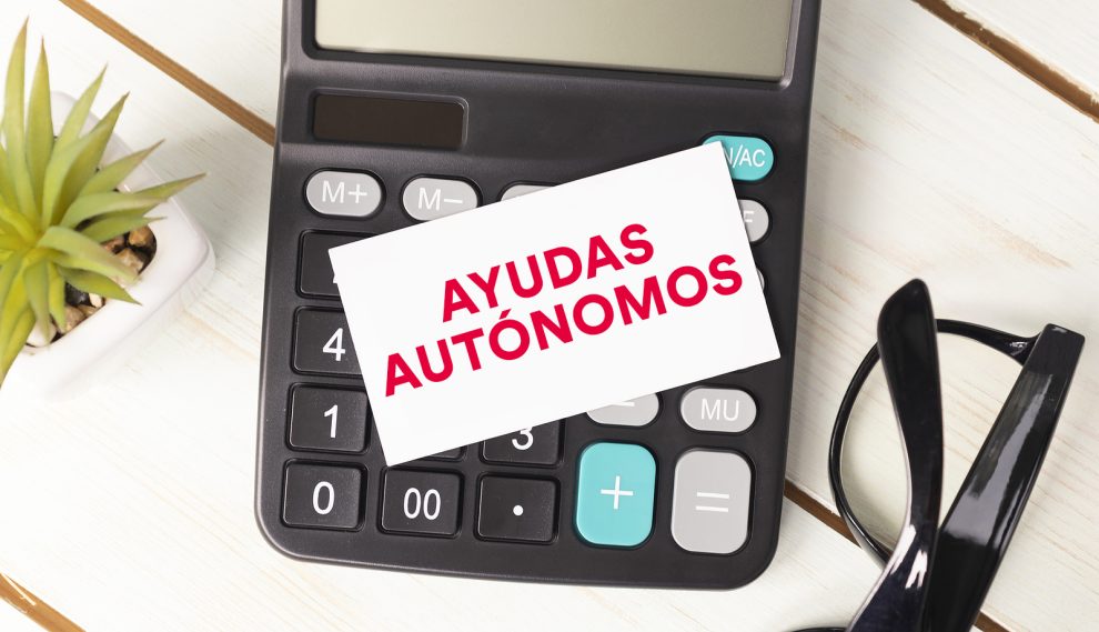 Financial aid text written on notepad with glasses